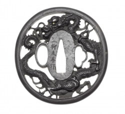 Mito School
An iron sukashi tsuba
Mito School, 19th century
Of oval form, carved and pierced wit ...