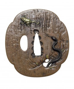 A copper tsuba
Nara School, 19th century
Of mokko form, bearing an irregular linear ground and i ...