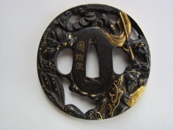 the mei on your tsuba reads CHIKAMOTO and kao, and is by an artist listed in Haynes’ Index as In ...