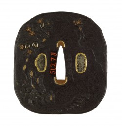 A crane is shown in waves at the lower right of the tsuba. Along the right and upper right is th ...