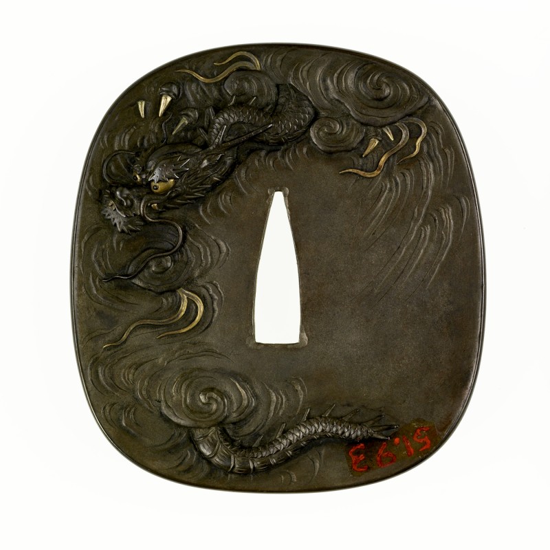 Tsuba with a Tiger and Dragon – Omori Teruhide 
On the front of the tsuba, a lion crouches ...