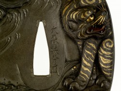 Tsuba with a Tiger and Dragon – Omori Teruhide 
On the front of the tsuba, a lion crouches ...