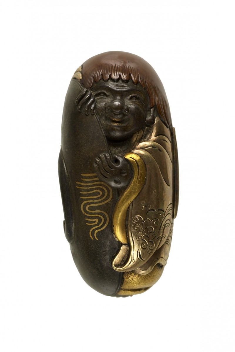 Kashira with a Shôjô and Sake Cup
Description	
English: At the left of the composition is a larg ...