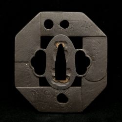 Iron, octagonal kawarigata shape. The image is of the tangs of swords arranged in pattern around ...