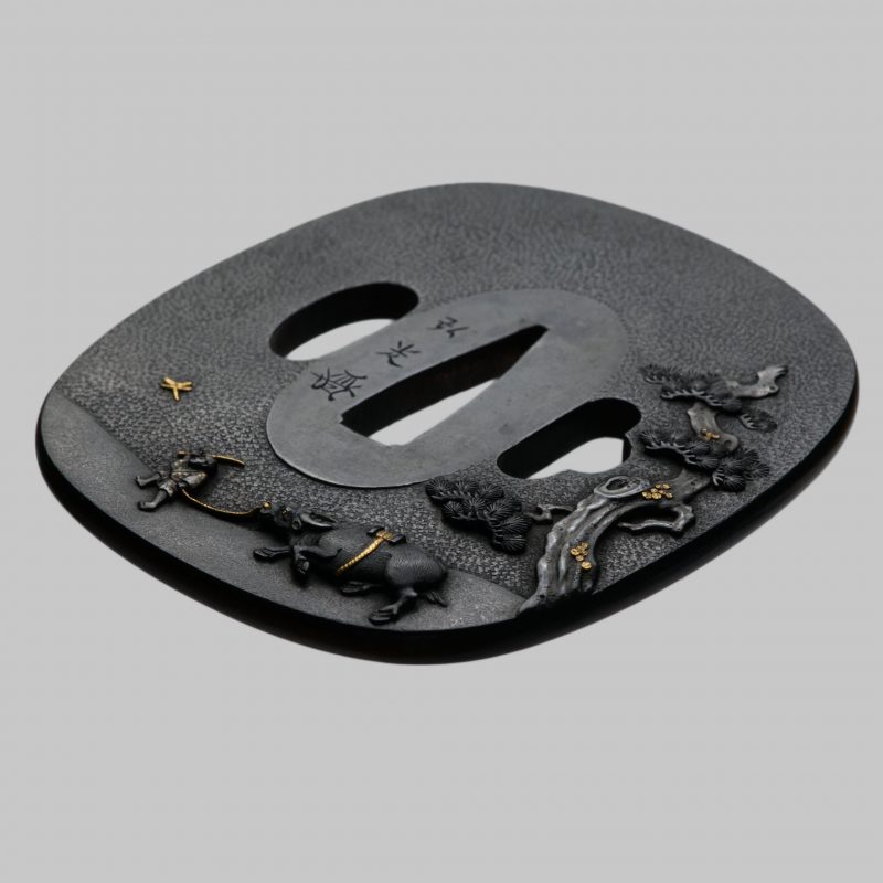 A beautiful shakudo Tsuba by Uchikoshi Hiromitsu. The scenery is beautifully worked in shakudo,  ...