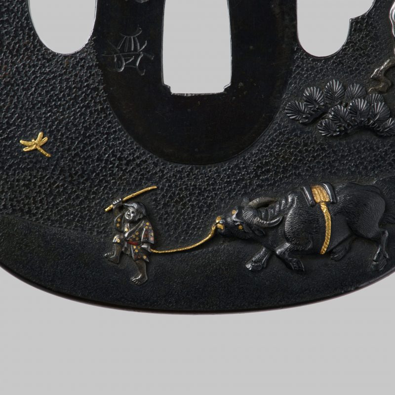 A beautiful shakudo Tsuba by Uchikoshi Hiromitsu. The scenery is beautifully worked in shakudo,  ...