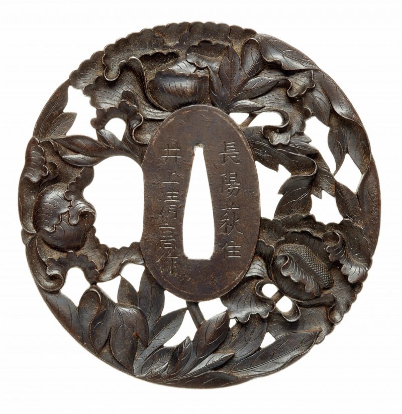 An iron tsuba. Edo period, second half 18th century

Of almost round shape, crisply carved and p ...