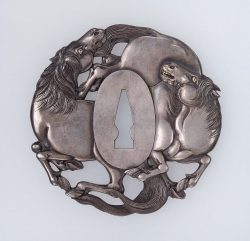Tsuba in the form of two horses
Japanese
Edo period
mid-19th century
Medium/Technique Main mater ...