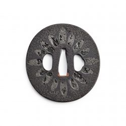 KUNITOMO TEIEI (ACTIVE EARLY 18TH CENTURY)
An Iron and Copper-alloy Hazama Tsuba
Edo period (161 ...