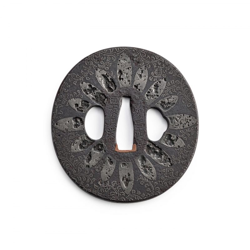 KUNITOMO TEIEI (ACTIVE EARLY 18TH CENTURY)
An Iron and Copper-alloy Hazama Tsuba
Edo period (161 ...