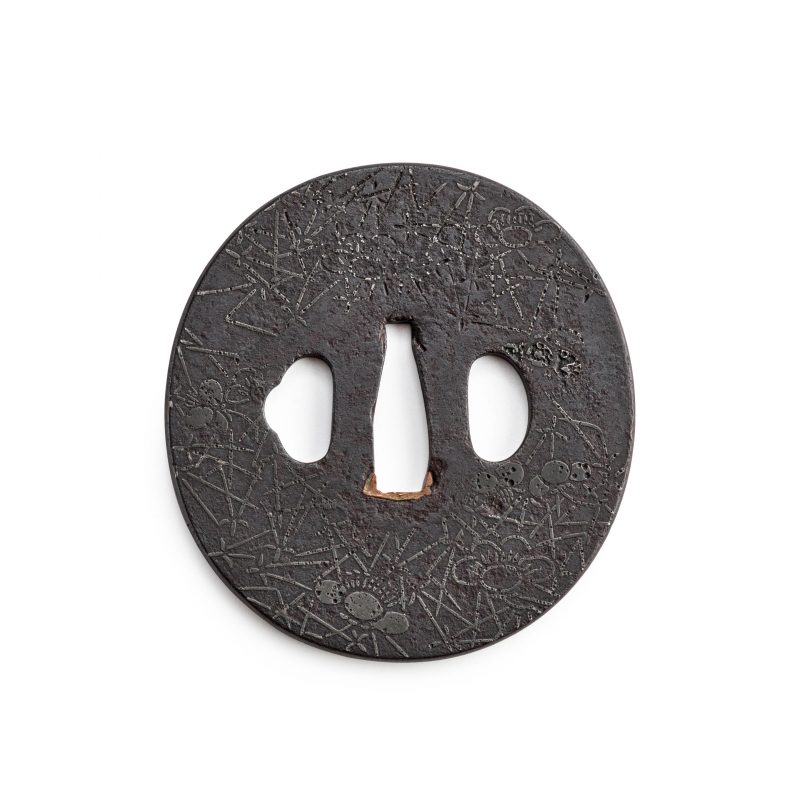 KUNITOMO TEIEI (ACTIVE EARLY 18TH CENTURY)
An Iron and Copper-alloy Hazama Tsuba
Edo period (161 ...