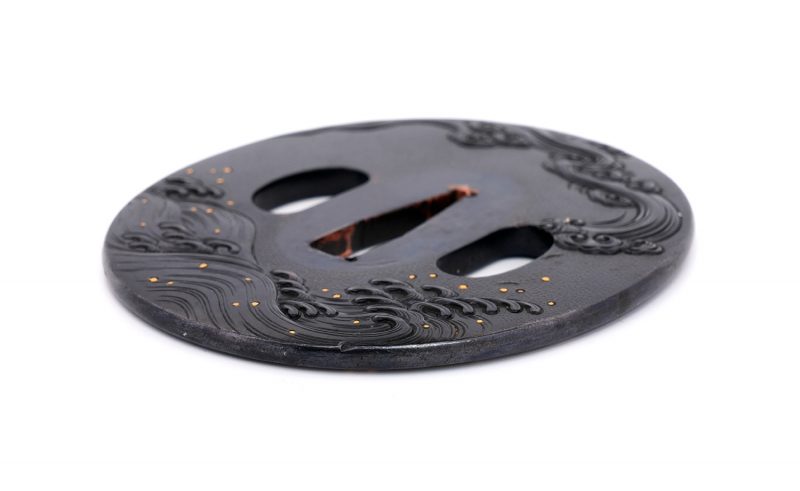 Tsuba with Wave Design
Unsigned (Mumei)
Height: 79.8 mm / Width: 73.1 mm / Seppa-dai thickness:  ...