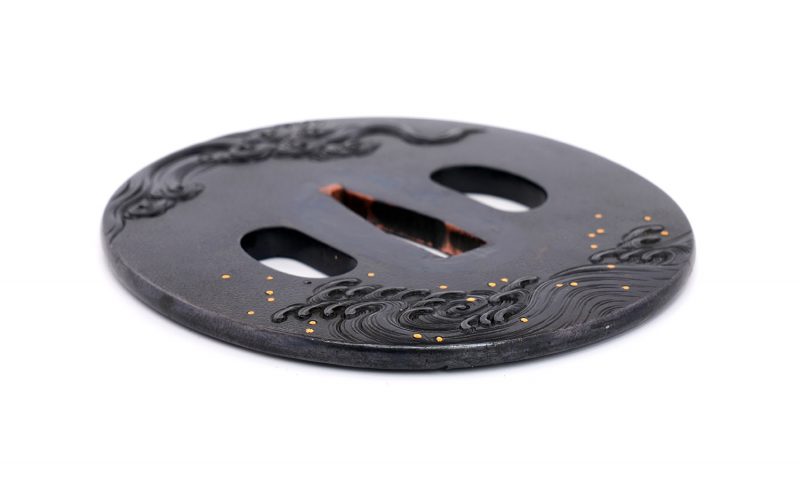 Tsuba with Wave Design
Unsigned (Mumei)
Height: 79.8 mm / Width: 73.1 mm / Seppa-dai thickness:  ...