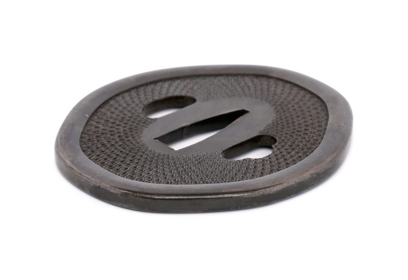 No.1340
Tsuba with Net Pattern
Unsigned (Mumei)
Height: 77.1 mm / Width: 69.35 mm / Seppa-dai th ...