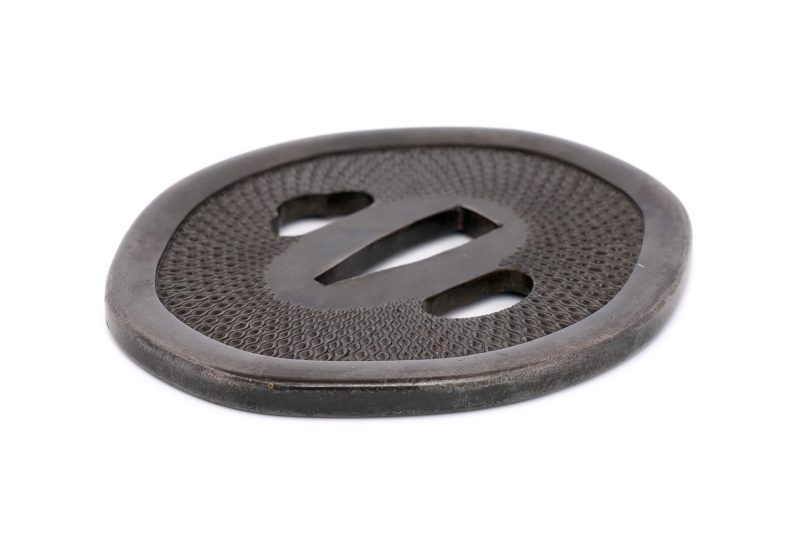 No.1340
Tsuba with Net Pattern
Unsigned (Mumei)
Height: 77.1 mm / Width: 69.35 mm / Seppa-dai th ...