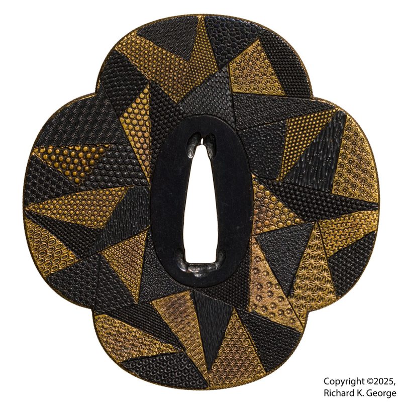 This one is still a bit of a head scratcher.  This mokko shaped tsuba measures 82.8mm(H) X 78.5m ...
