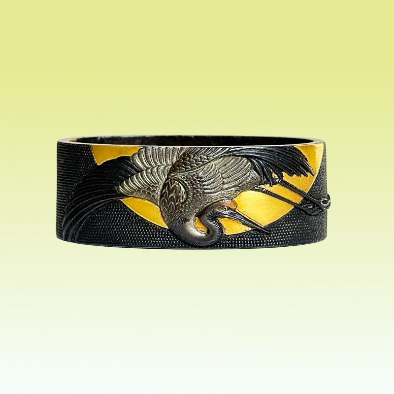 1744-1801 ( Edo period)

Tokubetsu Hozon

This is a magnificent fuchi made of shakudo, featuring ...