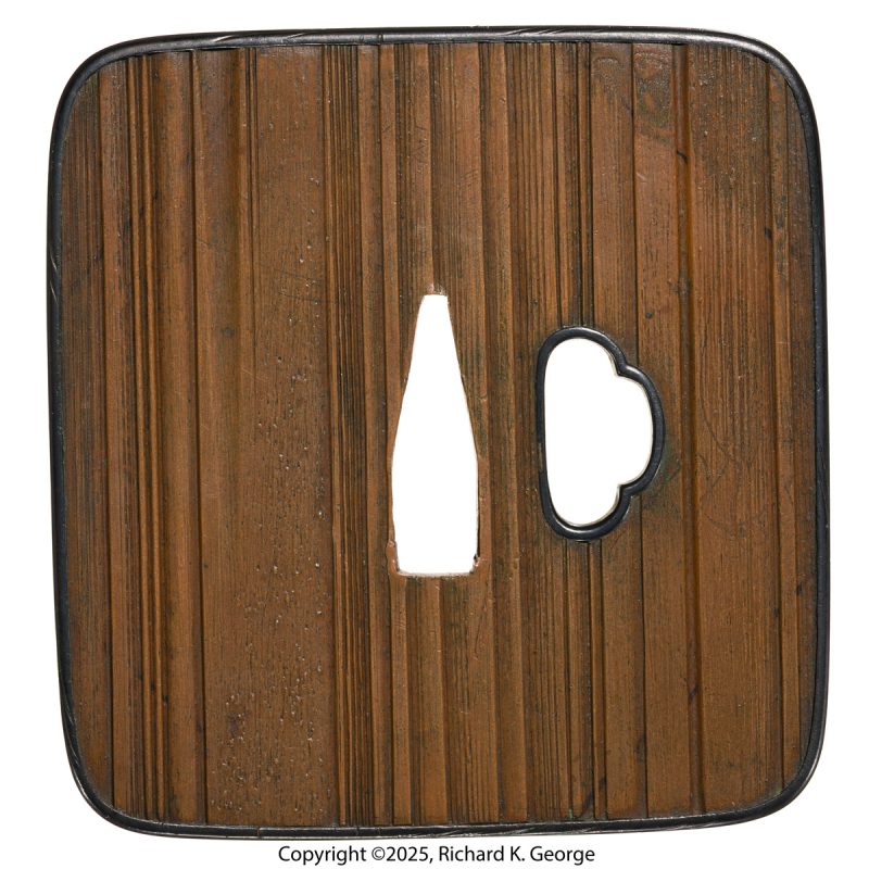This tsuba is another “burly” piece.  It is made of suaka (red copper) with a shakud ...