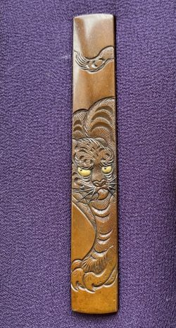 Before heading to work, I’m looking at the small koshirae with the fierce tiger painting b ...