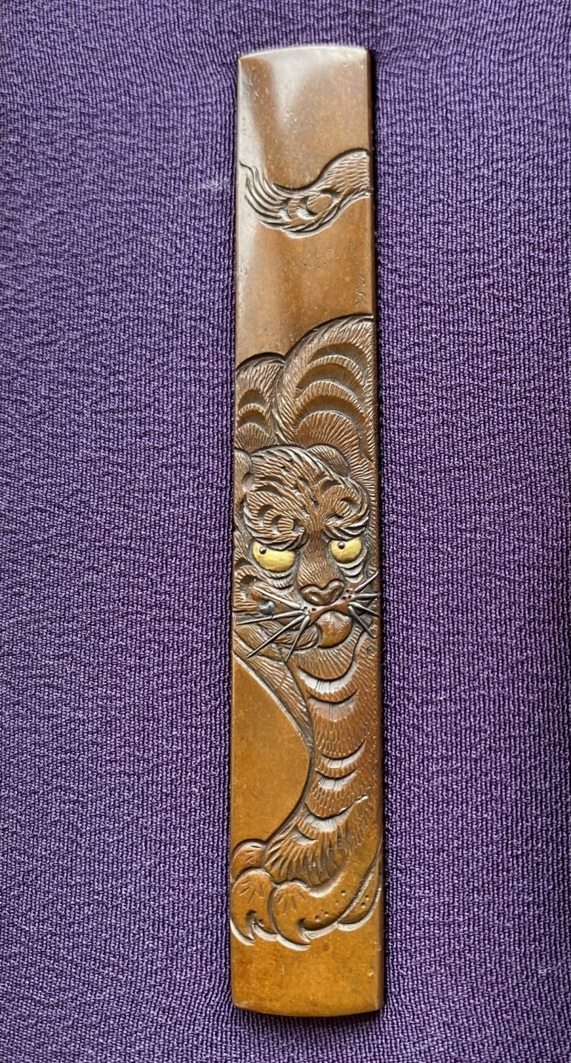 Before heading to work, I’m looking at the small koshirae with the fierce tiger painting b ...