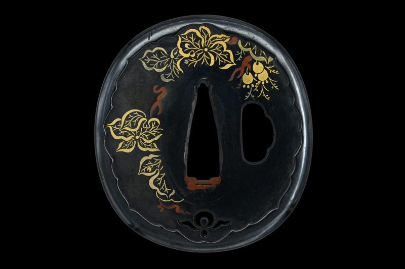 Tsuba: Umetada “Budō-mon no tsuba”

Signature/mei: Umetada

Material: shakudō ground, various so ...