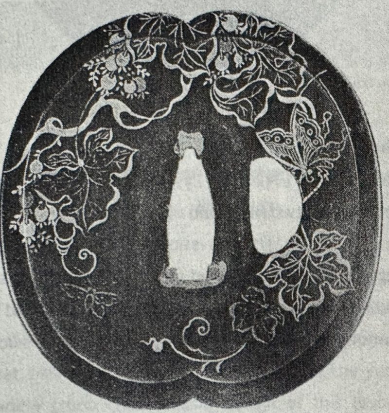 “Budō ni kochō-mon no zu tsuba”

Designated as jūyō-bunkazai and signed “Umeta Myōju”

futatsū-m ...