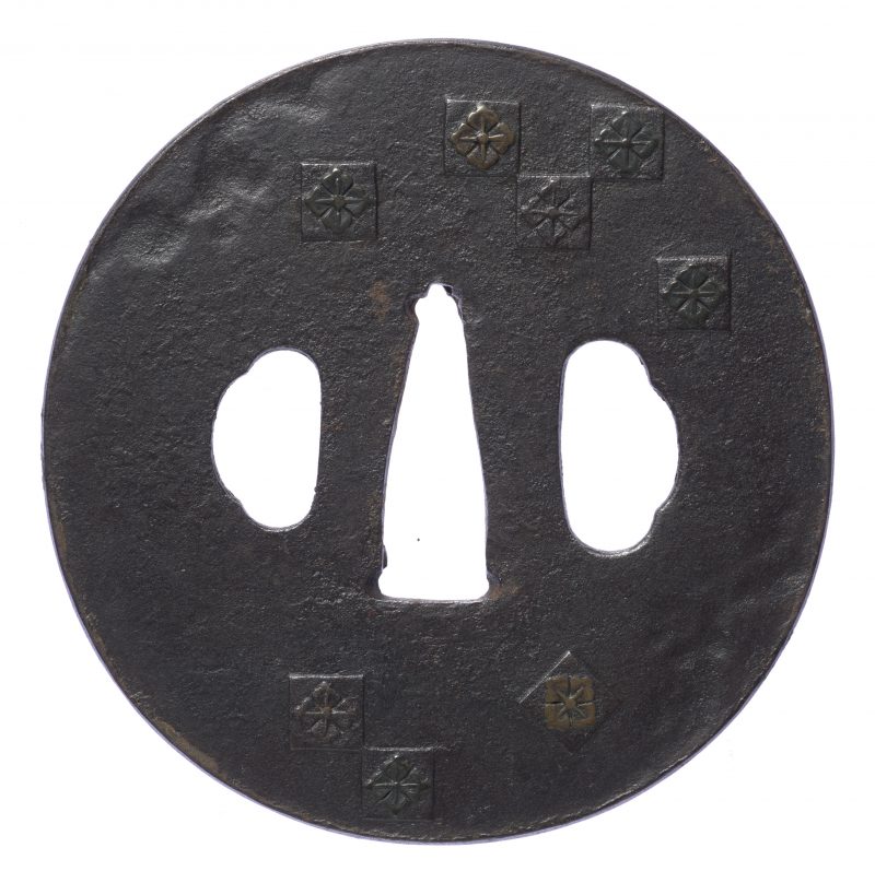 Translation:

Hanabishi-mon Chirashi Tsuba
(Scattered Floral Diamond Crest Tsuba)
Signed: Umetad ...